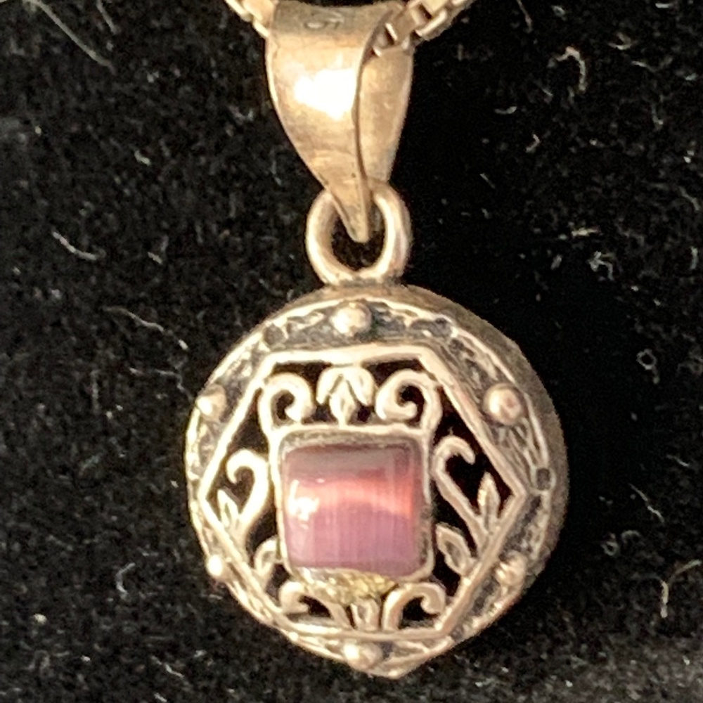 Silver necklace with purple stone